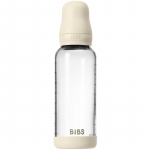 BIBS Baby Glass Bottle Silicone koolikuid ennetav pudel silikoonist lutiga Ivory 240 ml