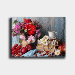 Pilt l&otilde;uendil Lilled, kohv ja raamatud