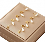 Kullast rippuvad k&otilde;rvar&otilde;ngad, kirurgiline teras, pikad p&auml;rlilehed, oks