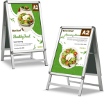 Newzeal A2 A-t&uuml;&uuml;pi k&otilde;nnitee silt, kahepoolne plakatiraam, stend, alumiiniumist krohvi tulemustabel kl&otilde;psraamiga v&auml;lireklaamile, h&otilde;bedane