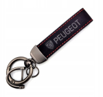 PEUGEOT v&otilde;tmehoidja koos paelaga - uus logo - must