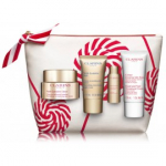 Clarins Nutri-Lumi&eacute;re Collection komplekt (p&auml;evakreem 50 ml. + &ouml;&ouml;kreem 15 ml. + essents 10 ml. + k&auml;tekreem 30 ml.) - 1 tk.