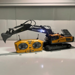 Kaugjuhitav Ekskavaator 2.4Ghz 11-kanaliline ehitusmasin 1:20 m&otilde;&otilde;tkava metall&auml;mbriga ja tuledega, sobib &otilde;ue randam&auml;nguasjadeks BC-1043 Yellow Excavator