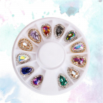 12 tk / ratas, v&auml;rviline kilpsulamist k&uuml;&uuml;neehted, kividest kalliskivist k&uuml;&uuml;nekunsti kaunistus