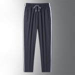 Suvised uued Loose Plus Fat Three Stripes Ice Silk p&uuml;ksid meestele ja naistele &otilde;hukesed elastsed kiirelt kuivavad vabaaja p&uuml;ksid 8XL