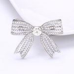 Korea Creative Pearl Bow pross Moodne lihtne n&ouml;&ouml;pn&otilde;el v&auml;ike aromaatne temperament korsaaksessuaarid kuld