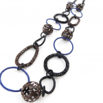 NOA [J4514] &ndash; disainerkaelakee 'Flora' pruun sinine pruun