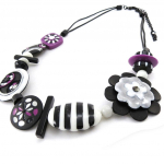 NOA [J2245] - disainerkaelakee  Steppes  must valge lilla valge