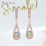 Moodne elegantne veetilga kuupmeetrist tsirkooniumoksiidist rippuvad k&otilde;rvar&otilde;ngad roosa kullav&auml;rvi k&otilde;rvar&otilde;ngad naistele pulmapeo ehted