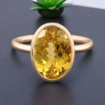 5,45 karaadise ovaalse l&otilde;ikega naturaalne kollane safiir 14K kollasest kullast k&auml;sitsi valmistatud s&otilde;rmus S sinine