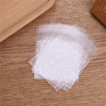 100 tk/partii l&auml;bipaistev tsellofaanist t&auml;piline kommik&uuml;psis, kinkekott isetehtud kott Pulma s&uuml;nnip&auml;evapidu L