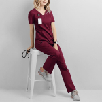 Naiste meditsiinilise vormikoorija komplekt Medical Scrubs &uuml;lemised p&uuml;ksid, riidest V-kaelusega n&ouml;&ouml;riga p&uuml;ksid S oranž