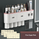 Magnetilise adsorptsiooniga &uuml;mberp&ouml;&ouml;ratud hambaharja hoidik, topeltautomaatne hambapasta pigistaja jaotur, hoiurest Vannitoa tarvikud 5 Cups roosa