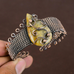 Loodusliku fossiilse koralli v&auml;&auml;riskivide k&auml;sitsi valmistatud vasest traadist m&auml;his reguleeritav k&auml;ev&otilde;ru A4L95