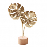 Kuldne h&otilde;lmikpuu lehtede kaunistus puidust mittev&auml;&auml;rismetallist sulgede lehtedega lumehelbe kujuke kuju skulptuur kodukontor elutuba t&ouml;&ouml;laua ornament C