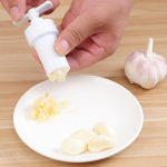 Uus ingveri k&uuml;&uuml;slaugu manuaalpress Twist Cutter Crusher Cooking Tool Plastikust k&uuml;&uuml;slaugupressid