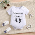 Vasts&uuml;ndinu puuvillane trikoo Coming Soon tr&uuml;kiga l&uuml;hikeste varrukatega kombinesoon imiku body 6-9M