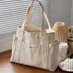 Suure mahutavusega l&otilde;uendist kandekotid t&ouml;&ouml;le s&otilde;itmiseks Kandekott Kolledži stiilis &Uuml;li&otilde;pilasr&otilde;ivaste raamat &Otilde;lakott