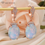 Moodsad kuupmeetrist tsirkooniumoksiidist suured v&auml;rvilised ovaalsed kristallist tilkk&otilde;rvar&otilde;ngad naistele pulmaroosist kullav&auml;rvi ehted