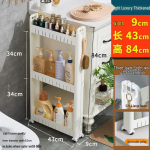 &Uuml;limalt kitsas 10 cm laiune ratastega hoiuriiul k&ouml;&ouml;ki, vannituppa, k&uuml;lmkapi vahesse ja elutuppa. P&otilde;randal seisav k&auml;ru.