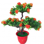 Kunstlik roosi&otilde;ieline tervitus m&auml;nnitaimepotti kodus t&ouml;&ouml;laua kontorikaunistus oranž