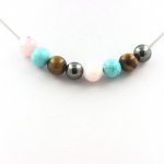 Pierres et Min&eacute;raux. Collier perles H&eacute;matite + Turquoise + Oeil de Tigre + Opale Rose 8 mm Chaine en acier inoxydable.