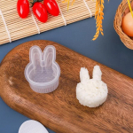 Loominguline isetegemise sushivormikarp, l&auml;bipaistev kolmnurkne sushivalmistaja vorm Onigiri riisipallitoit, press-sushik&ouml;&ouml;k Bento tarvik