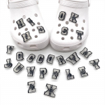 26 tk helendavad inglise t&auml;hestiku seeria PVC kingav&otilde;lusid kingade kaunistamiseks 26pcs