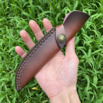 24,5 CM kaitse&uuml;mbris, nuga, l&otilde;hestatud nahk, fikseeritud teraga noakate, nahast &uuml;mbris. 24cm