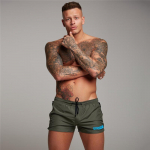 Muscleguys meeste pehmed ja siledad rannap&uuml;ksid J&otilde;usaali Fitness dressipluusid Kulturismi elastne v&ouml;&ouml;koht Prindiga p&uuml;ksid &otilde;hukesed vabaaja p&uuml;hadep&uuml;ksid M