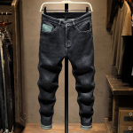 Kevadised ja s&uuml;gisesed uued mustad teksad Meeste moebr&auml;nd tr&uuml;kitud tikandid Micro Harlan vabaaja trendikad pikad p&uuml;ksid meestele 28