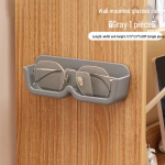 Seinale paigaldatav prillide hoiuriiul l&uuml;hin&auml;gelikkuse ja p&auml;ikeseprillide jaoks - dekoratiivne v&auml;ljapanek ja prillide organiseerija. opp bag + film