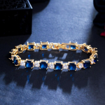 CMM Glitters kuubikujuline tsirkoon kuldne tennisek&auml;ev&otilde;ru safiir