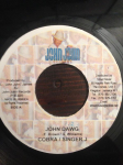 7-tolline plaat MAD COBRA & SINGER J - John Dawg NONE John John Recor 2005 Jamaica Reggae, Ska & Dub Kasutatud