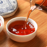 Yunnan Pu'er Tee Lao Ban Zhang K&uuml;ps Tee Kook 100g Qizi Kook Tee K&uuml;ps Pu'er Tee