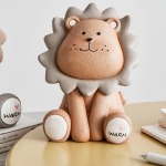 L&otilde;vi hoiup&otilde;rsast rahakast Hall pruun istuv hoiup&otilde;rsas Armas s&auml;&auml;stupott lastele s&uuml;nnip&auml;evaks kingituste rahahoiukast Kodukaunistus