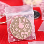 1000 tk Mini l&auml;bipaistev PE t&otilde;mblukuga kotid V&auml;ikeste esemete hoiustamiskott Plastikust pakend K&otilde;rvar&otilde;ngasr&otilde;ngas Pillid ripatsiga kilekotid proovikott 2.5x3cm 1000pcs