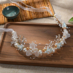 Elegantne t&uuml;drukute pruudi peapael Imiteeritud p&auml;rlitest juustest peakate lillep&auml;rg Pruudi vanikupea r&otilde;ngas pulmapeapaelad juukseehted