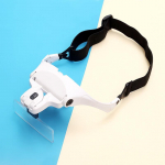 Pea k&uuml;lge kinnitatav lugemisparandus LED-valgusega, kunstripsmed, pookimisprillid, suurendusklaas valge