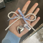 Korea valge kikis&otilde;lme s&uuml;damega v&otilde;tmehoidja naiste magus v&otilde;lu p&auml;rliga vibu seljakott V&otilde;tmehoidja K&auml;sitsi valmistatud ehted Ornamendikotid Ripatsid Kingitused sinine
