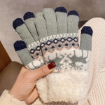 Paar m&otilde;nusaid fliisvoodriga talvekindaid, millel on armas hirve žakaardisain must