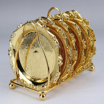 7 tk. K&otilde;rgekvaliteediline kodukaunistus, kohvitass, teealus, soojusisolatsioonipadi, puuviljaalus, toidualus kuld