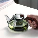 Elegantne ja mitmek&uuml;lgne klaasist teekann integreeritud filtriga - Ideaalne igale teehuvilisele, sobib suurep&auml;raselt koduseks ja kontorikasutuseks Teapot