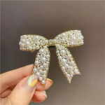 Uued Korea Sweet Simulated Pearl Bowknot juuksen&otilde;elad Naistele m&otilde;eldud juuksen&otilde;elad Moodsed juukseaksessuaarid juukseklambrid one size kuld