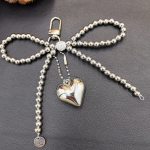 Korea &scaron;ikk Pearl Bow h&otilde;bedane armastuse ripats v&otilde;tmehoidja AirPodsi kinnitusega mobiiltelefoni jaoks