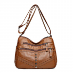 Naiste pehmest nahast suure mahutavusega &otilde;lakott, mitme kambriga keskealise ema kott