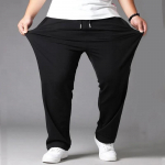 Meeste 10XL &uuml;lisuured plusssuurused mustad vabaaja p&uuml;ksid dressip&uuml;ksid elastne v&ouml;&ouml;koht spordijogerid kottis p&uuml;ksid p&uuml;ksid meeste t&auml;navar&otilde;ivad 10XL must