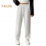 Naiste pikad p&uuml;ksid elastsed k&otilde;rge v&ouml;&ouml;kohaga sirge laia s&auml;&auml;rega vabaaja p&uuml;ksid taskutega &Uuml;hev&auml;rvilised vahvlitekstuuriga dressip&uuml;ksid S valge