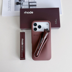 Huulepulgast inspireeritud telefoni&uuml;mbris Apple'i seadmetele Silikoonist p&otilde;rutuskindel pehme &uuml;mbris 3D-disainiga Kanna oma huulepulka 15pro max kohv