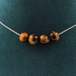 Pierres et Min&eacute;raux. Collier 4 perles Oeil de Tigre 8 mm. Chaine en acier inoxydable Collier femmes, hommes. Taille personnalisable.